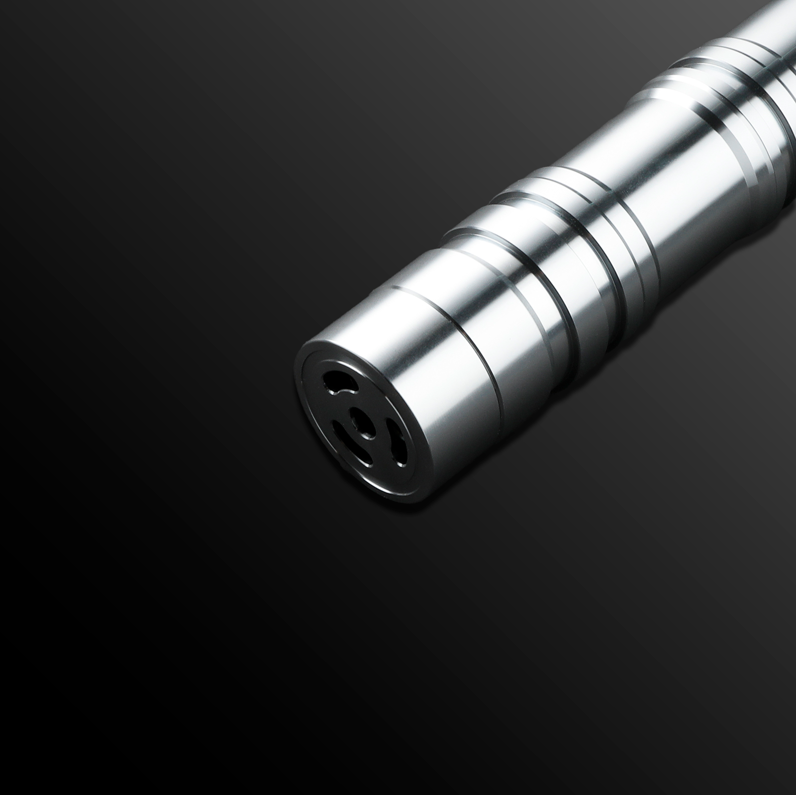 Monolith Silver Light Saber glowing brightly in a dark room - Battle Sabers