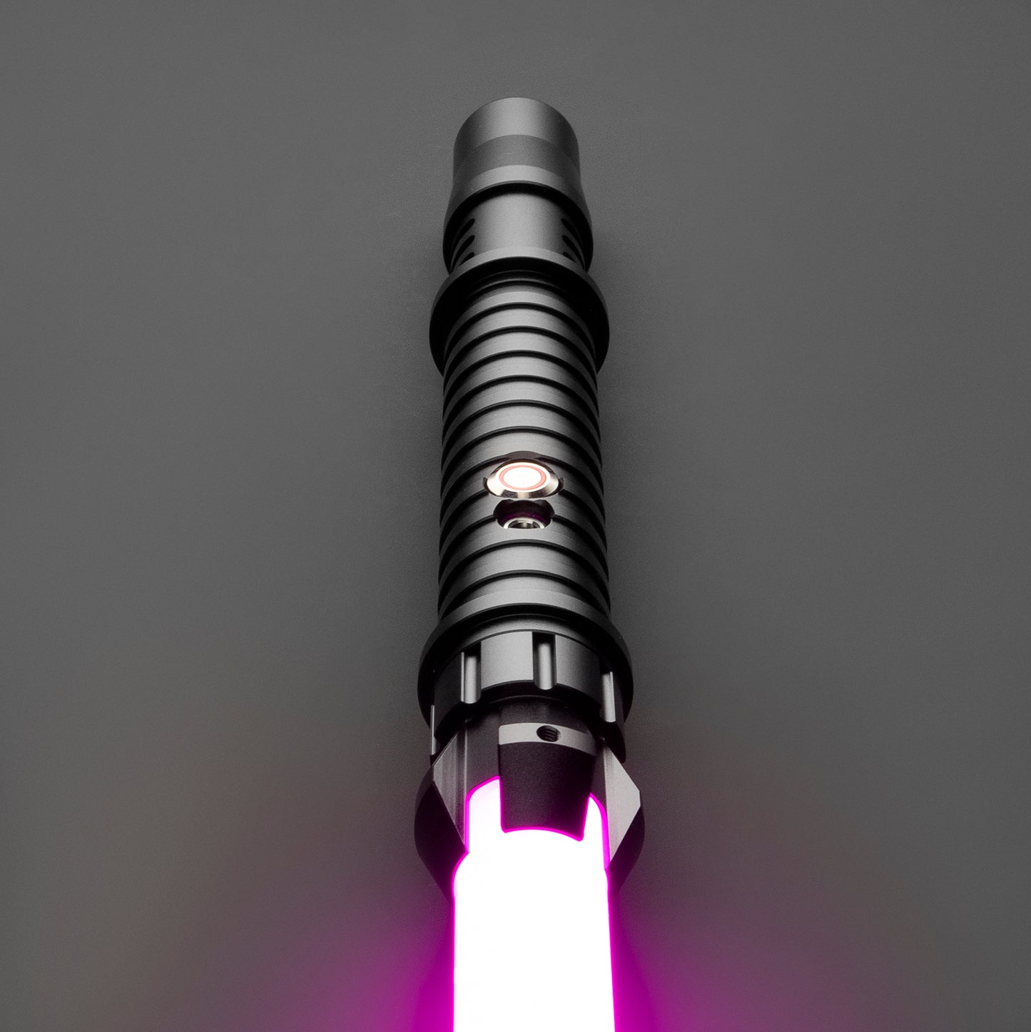 Electrum Light Saber glowing brightly in a dark room - Battle Sabers